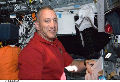STS-129 CDR Hobaugh poses for a photo on the FD