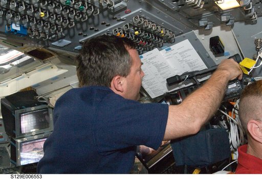 STS-129 MS3 Foreman works with a Video Camera on the FD