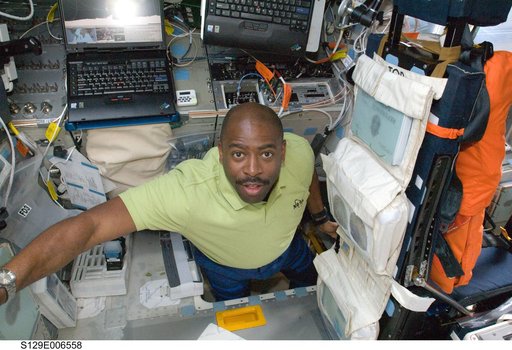 STS-129 MS1 Melvin poses for a photo on the FD