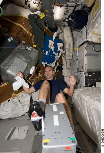 STS-129 MS2 Bresnik exercises on the Middeck