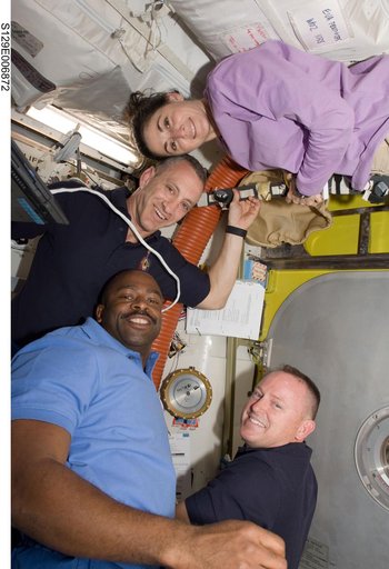 View of Crew Members in the Airlock during STS-129/ Expedition 21 Joint Operations