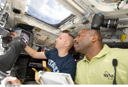STS-129 Crew Members transfer the ELC1 from the Payload Bay to the ISS