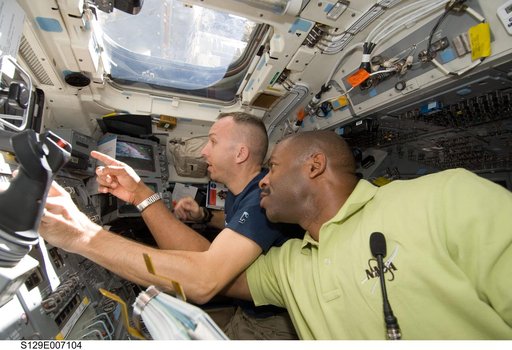 STS-129 Crew Members transfer the ELC1 from the Payload Bay to the ISS
