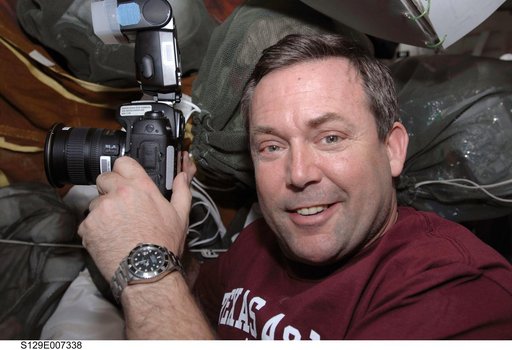 STS-129 MS3 Foreman poses for a photo on the MDDK