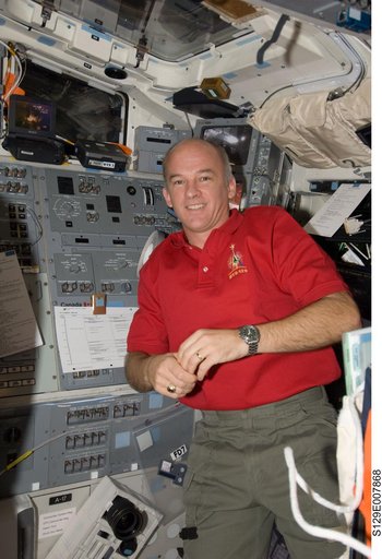 Expedition 21 FE-5 Williams poses for a photo on the Atlantis Flight Deck
