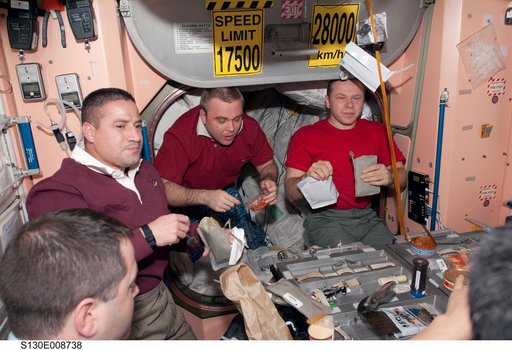 Crewmembers Share a Meal in Node 1