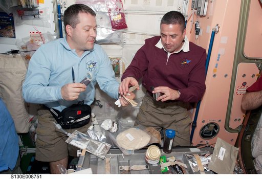 Crewmembers Share a Meal in Node 1