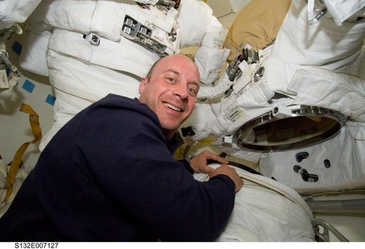 Reisman works on EMU Spacesuit in the MDDK during STS-132