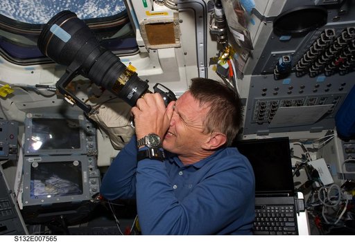 Sellers takes photo at window in the FD during STS-132