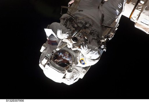 Reisman attached to an APFR on EVA 1 during Joint Operations