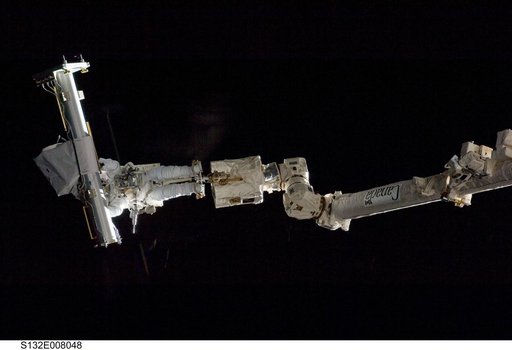 Reisman attached to an APFR on EVA 1 during Joint Operations