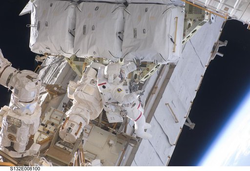Bowen works with the Battery ORUs during EVA 1