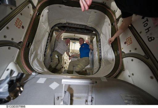 STS-133 and Expedition 26 crew enter PMM (Permanent Multipurpose Module)