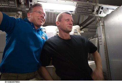 STS-133 and Expedition 26 crew enter PMM (Permanent Multipurpose Module)
