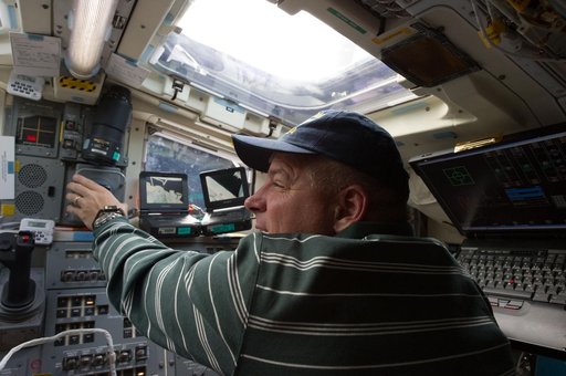 View of STS-134 Pilot Johnson working on the Flight Deck