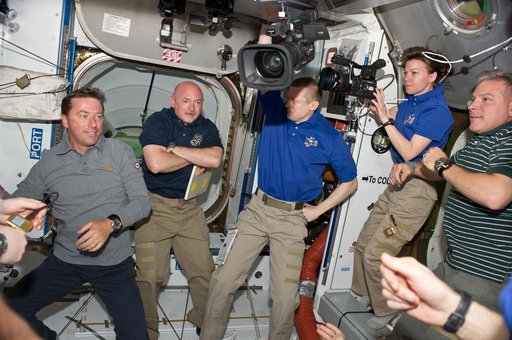 STS-134 and Expedition 27 Crew Members greet one another after Docking
