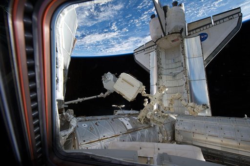 View of Endeavour docked to the ISS and the AMS-2 during Transfer