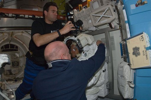 STS-134 Crew Members working in the Airlock at the end of EVA-3