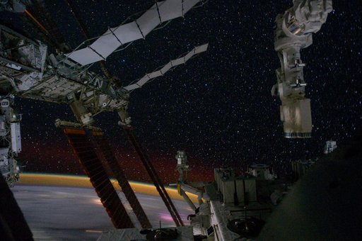 Partial view of the ISS and Earth's Horizon at Night