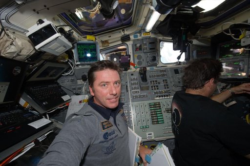 STS-134 Crew Members work on the Flight Deck