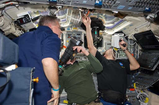STS-134 Crew Members working on the Flight Deck