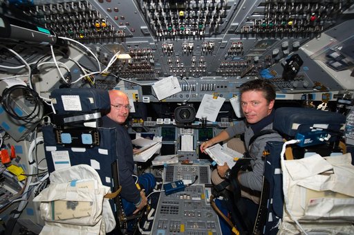 STS-134 Crew Members working on the Flight Deck