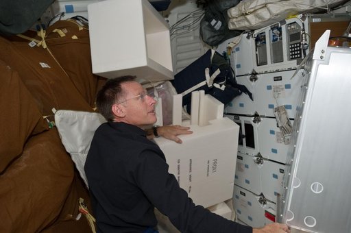 Ferguson works with Stowage on Atlantis Middeck