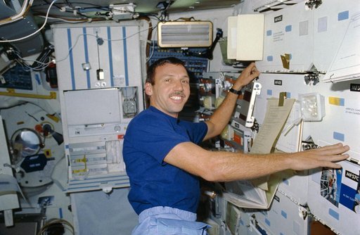 STS-26 Mission Specialist (MS) Hilmers prepares meal on OV-103's middeck