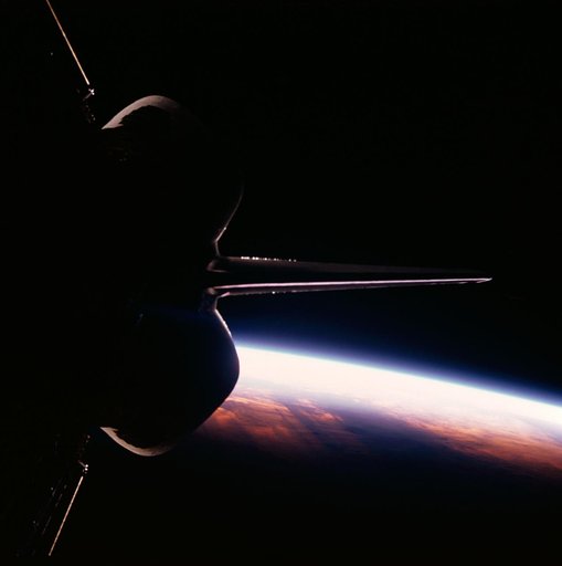 STS-26 Discovery, OV-103, onboard view of the Earth sunrise