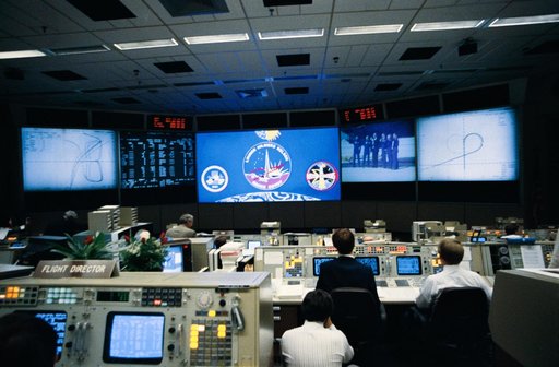 JSC MCC Bldg 30 personnel monitor STS-26 post landing activities