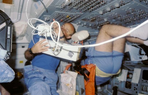 STS-29 Discovery, OV-103, Pilot Blaha with IMAX camera on aft flight deck