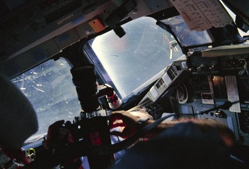 STS-29 Discovery, OV-103, MS Bagian uses video camera on forward flight deck