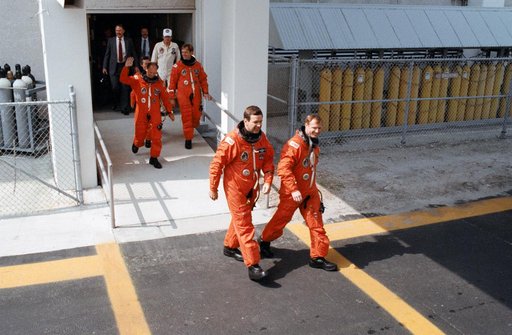 STS-30 crewmembers leave KSC O&C Bldg during launch preparations