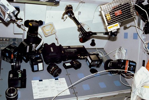STS-31 camera & photographic equipment displayed on OV-103's aft flight deck