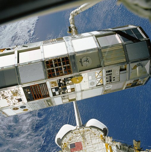 LDEF grappled and positioned by RMS over OV-102's payload bay during STS-32