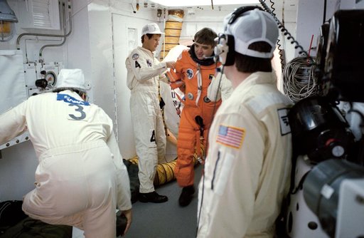 STS-32 Commander Brandenstein dons LES equipment in KSC LC Pad 39A white room