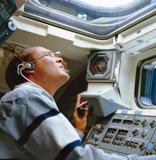 STS-33 MS Carter operates translation hand control (THC) on aft flight deck