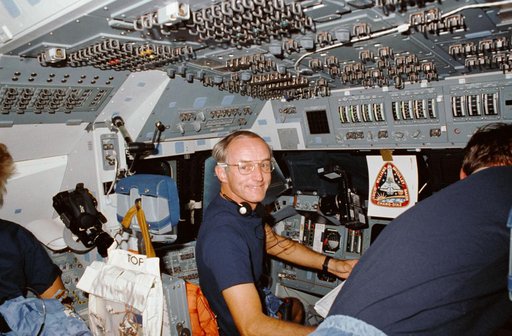 STS-34 Commander Williams looks away from forward flight deck controls