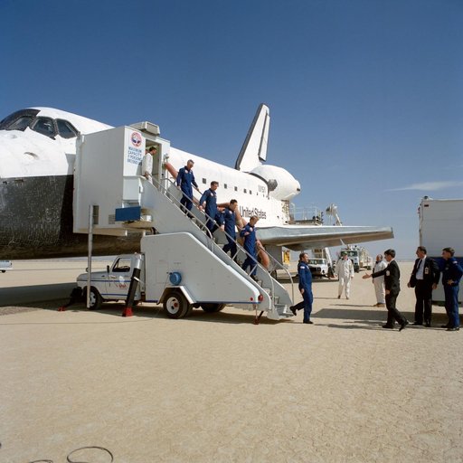 STS-36 crewmembers egress Atlantis, OV-104, via stairway after EAFB landing
