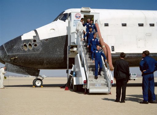 STS-36 crewmembers egress Atlantis, OV-104, via stairway after EAFB landing