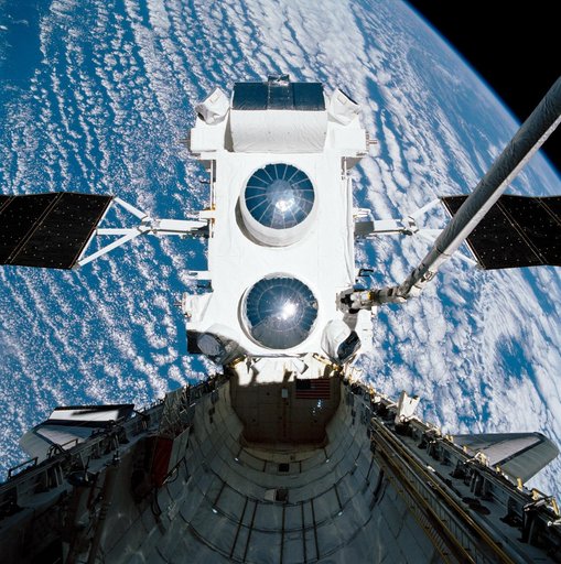 STS-37 Gamma Ray Observatory (GRO) held by RMS over OV-104's payload bay
