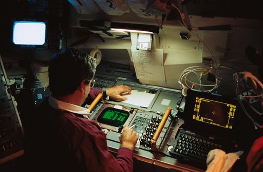 STS-39 MS Veach monitors AFP-675 panel on OV-103's aft flight deck