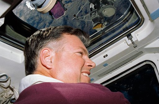 STS-39 Commander Coats on OV-103's flight deck watches SPAS-II/IBSS deploy