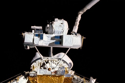 STS-39 SPAS-II IBSS is grappled by RMS over OV-103's payload bay (PLB)