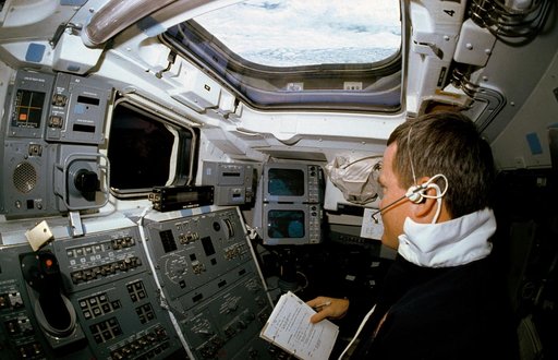 STS-41 MS Melnick experiments with VCS on OV-103's aft flight deck