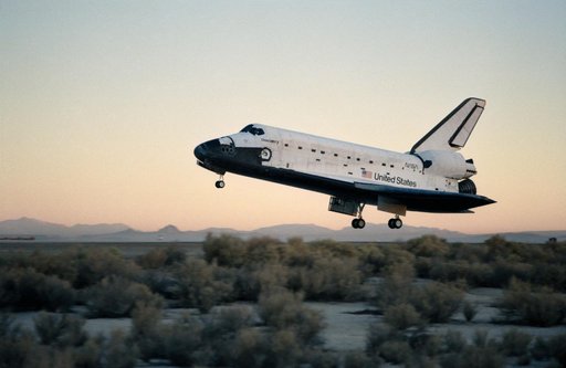 STS-41 Discovery, OV-103, glides over concrete runway 22 at EAFB, California