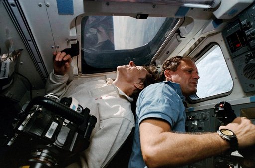 STS-42 crewmembers take a look at the Earth from OV-103's aft flight deck