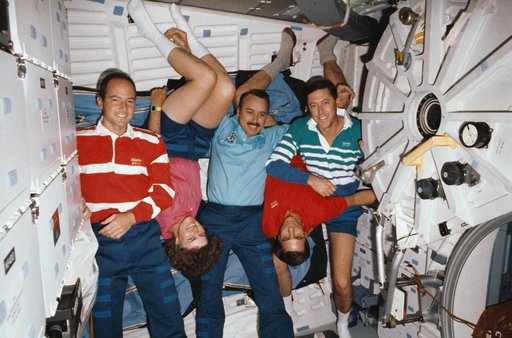 STS-43 crewmembers pose for onorbit (in space) portrait on OV-104's middeck