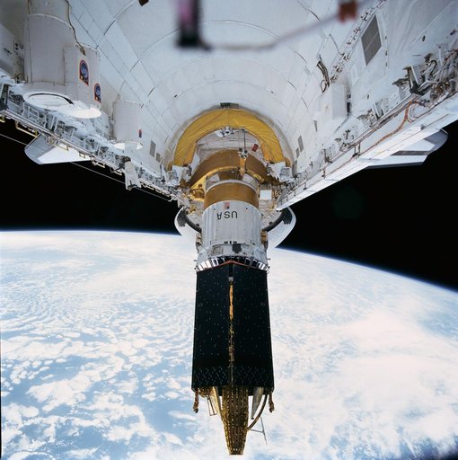 STS-43 TDRS-E / IUS is deployed from OV-104's payload bay (PLB)