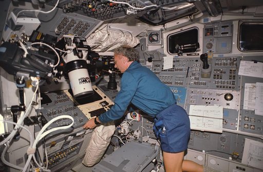 STS-45 Payload Specialist Frimout at controls on OV-104's aft flight deck